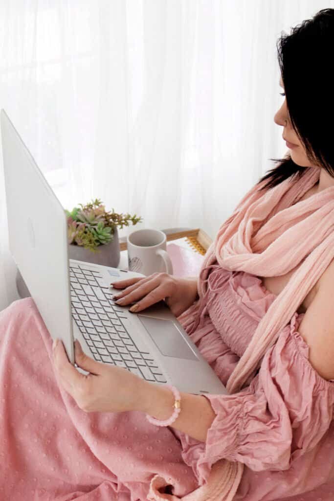 woman in pink updating her personal brand