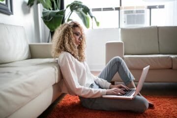 woman sitting at computer updating her online presence